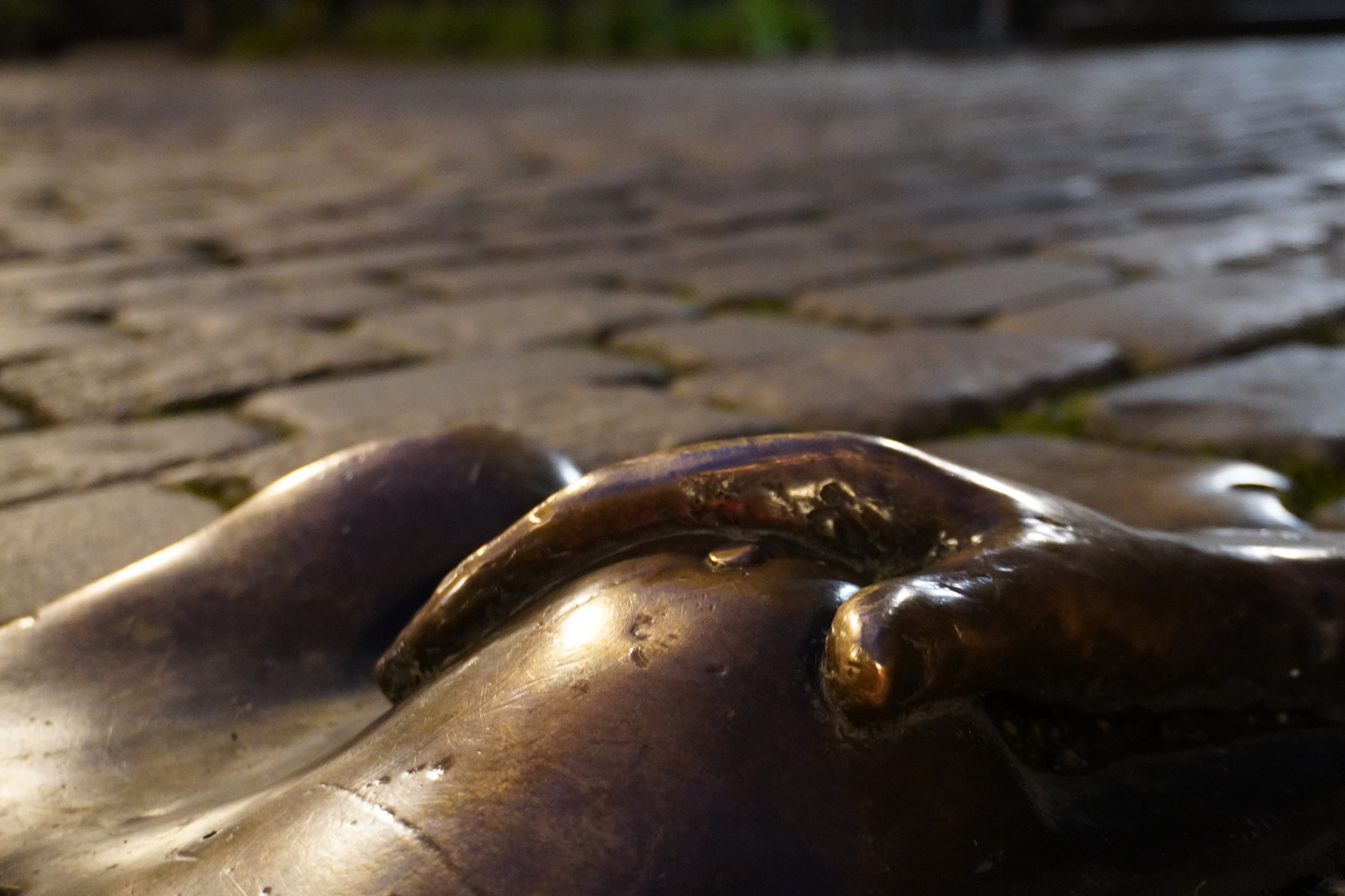 Profile of woman's face stylized and edited with hellish coloring.