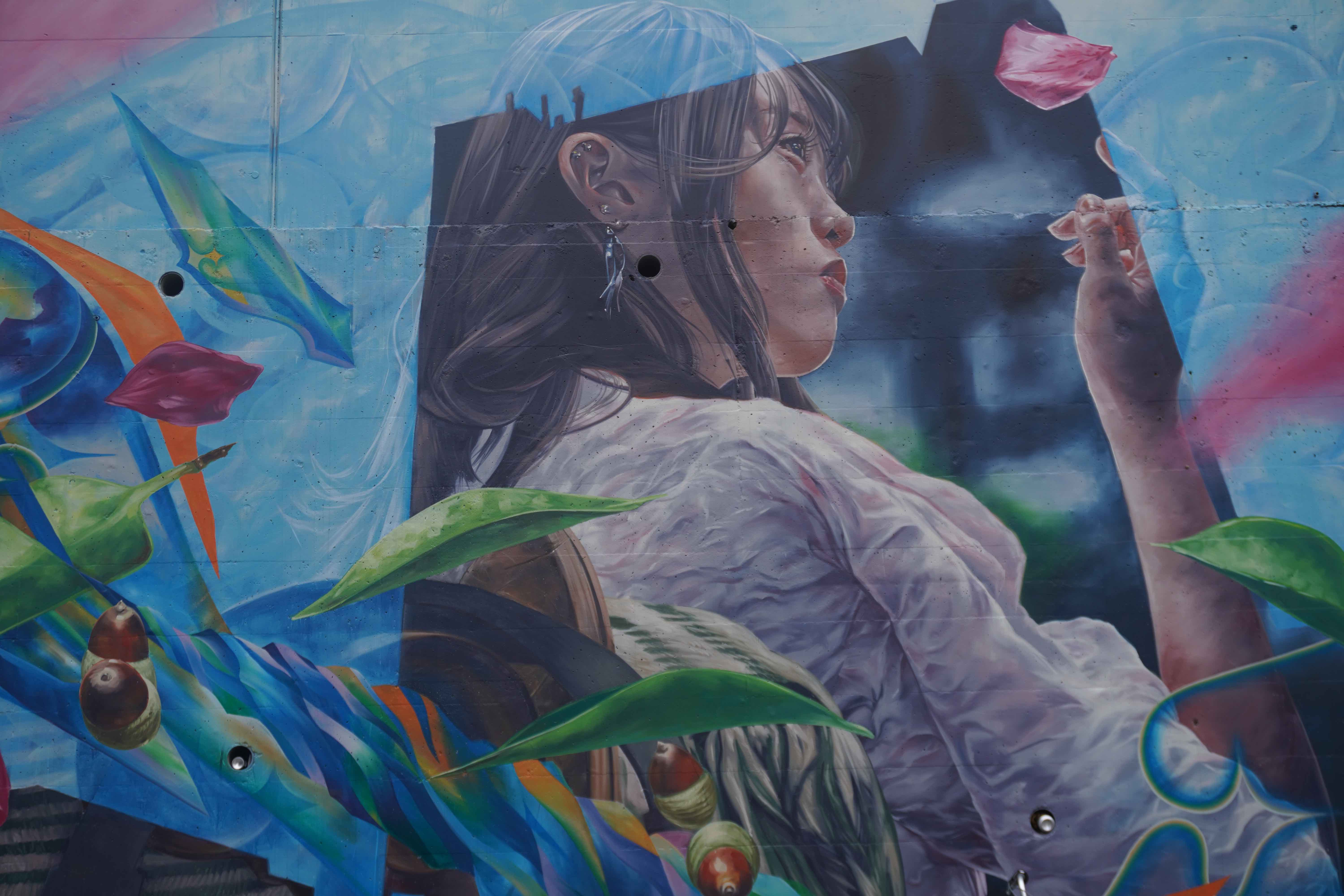 Elegant graffiti art of a Japanese woman catching a rose petal.