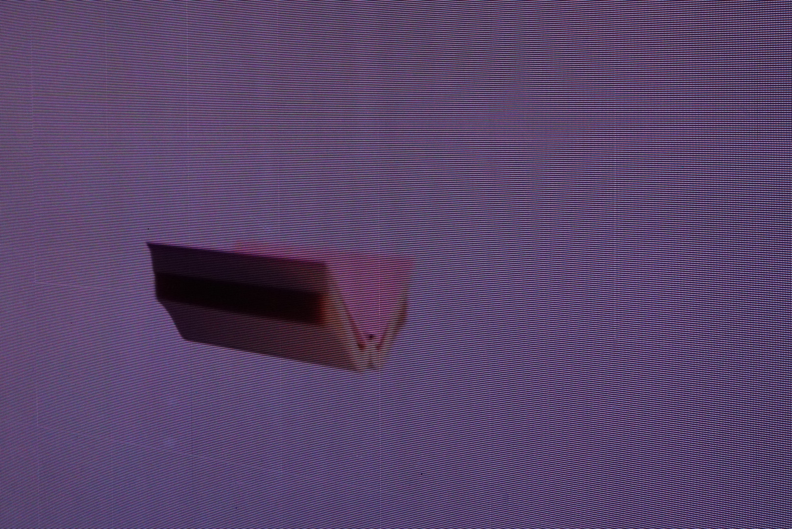 A raccoon balloon hanging or hovering at a dead end in a Nakano mall.